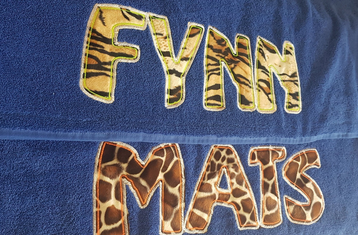 Children's beach towel with animal print